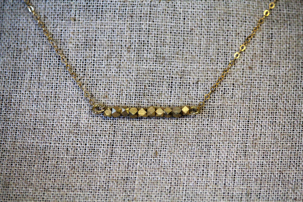 Gold toned nugget bar on a 14kt gold filled chain