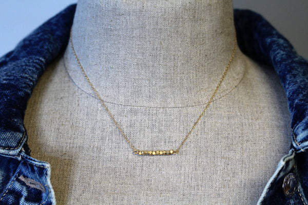 Gold toned nugget bar on a 14kt gold filled chain